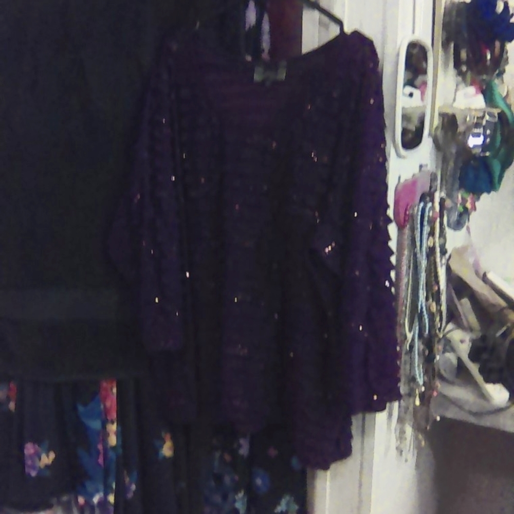 Women's blouse the color is dark purple. My camera on my tablet is not very good